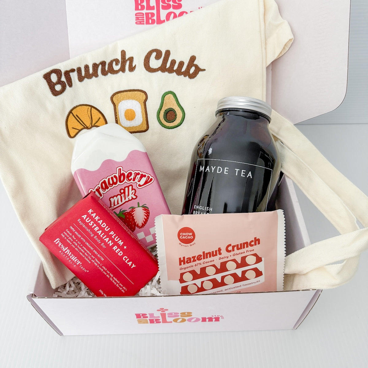 Gift box with 'Brunch Club' tote bag, 'Strawberry Milk' vase , 'Mayde Tea loose leaf tea, a chocolate slab, and a body bar | Perth Delivery